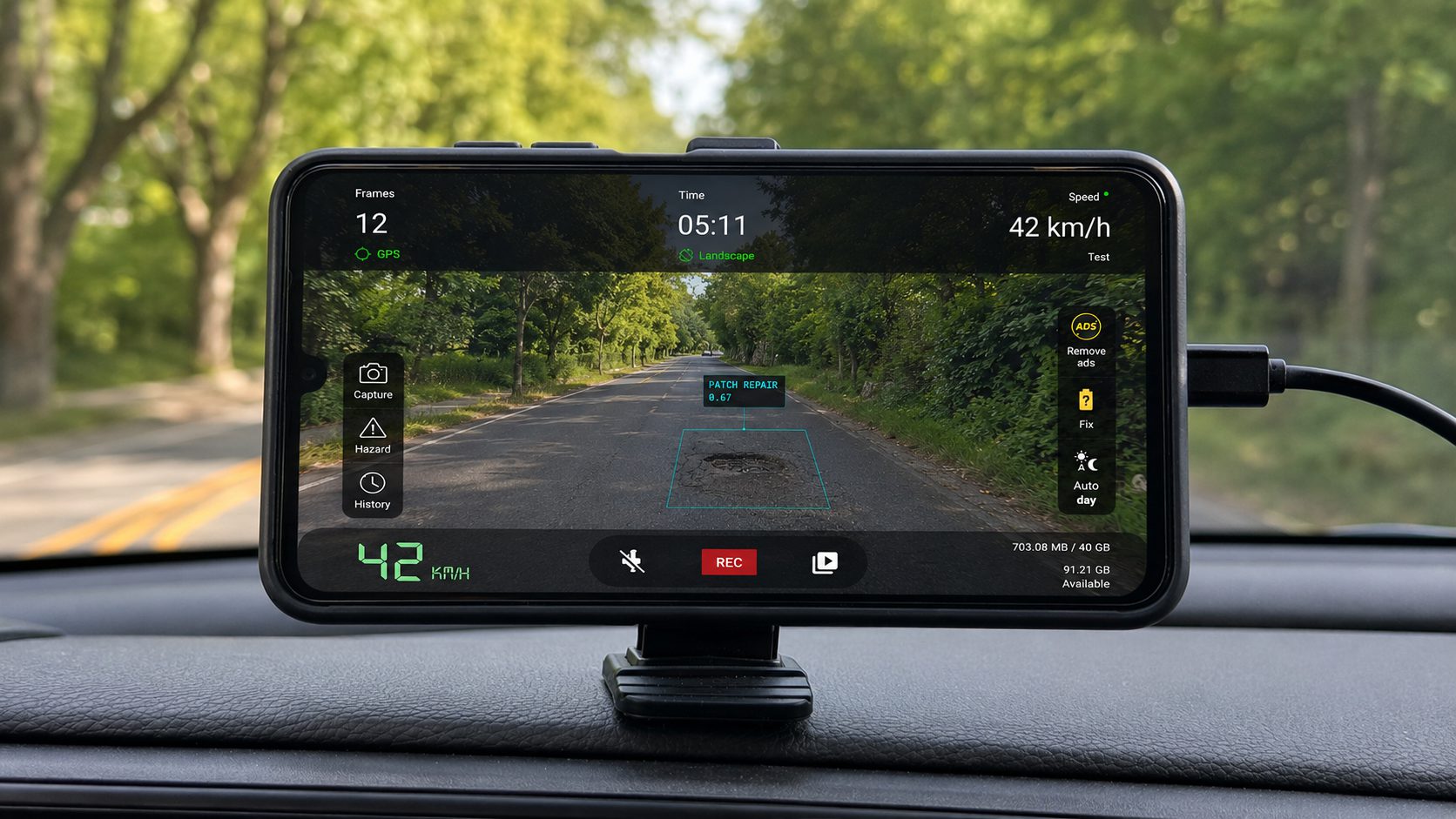 The RoadScout app on a dash-mounted Android phone, detecting a patch repair while driving